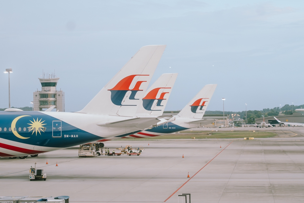 Malaysia Airlines aircraft lined up at an airport